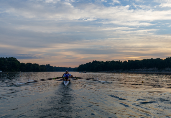FISU Rowing 2026 Photos. Available for Download. Photo of rower on Fanshawe Lake at Sunset.